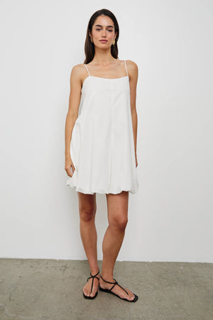 The Blanca is a bubble-hemmed mini dress with big personality. Crafted in crisp cotton poplin—fully lined—with subtle stretch and adjustable straps.