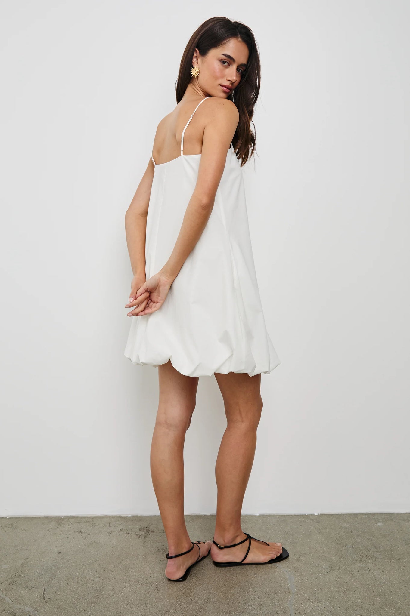 The Blanca is a bubble-hemmed mini dress with big personality. Crafted in crisp cotton poplin—fully lined—with subtle stretch and adjustable straps.