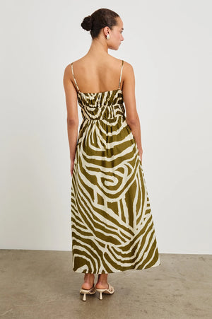 The Fatima is an airy sundress crafted from luxe beach cotton printed with a hand-painted design. Featuring concealed pockets, a smocked waist, and adjustable straps, this midi dress combines comfort with day-to-day practicality.