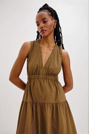The Genevieve maxi dress is designed for effortless wear, featuring a flattering A-line fit and a cut-out detail at the back.