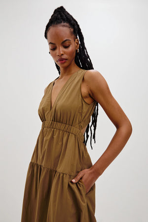 The Genevieve maxi dress is designed for effortless wear, featuring a flattering A-line fit and a cut-out detail at the back.