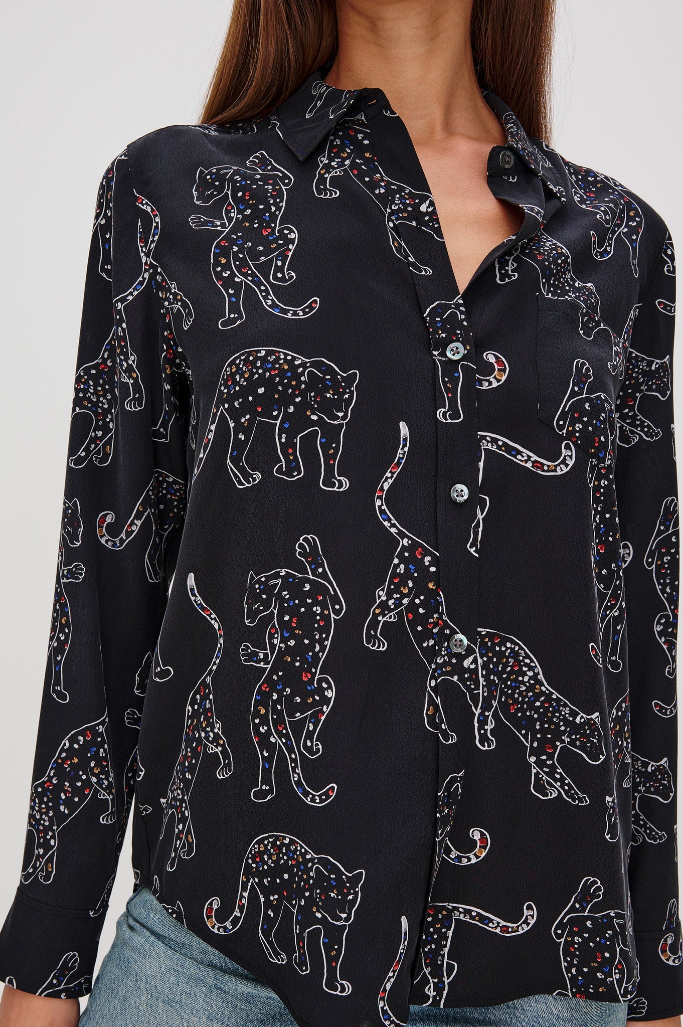Black shirt with panther pattern worn by a person