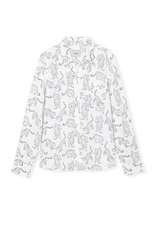 White lace dress with black animal pattern on a white background