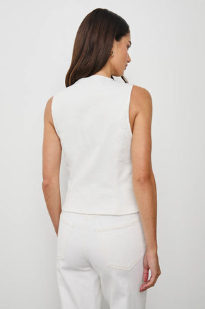 The La Jolla is a cropped denim vest featuring horn buttons and unique crochet patch pockets. Its cotton fabrication provides a flattering structure with just the right amount of subtle stretch.