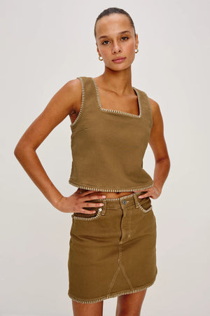 Inspired by 'It' girls of the 90s, the Laurel is a high-rise mini with a fitted waist, zipper fly, and A-line shape. Complete with a contrast white blanket stitch in a 100% cotton fabrication, this skirt is an instant classic.