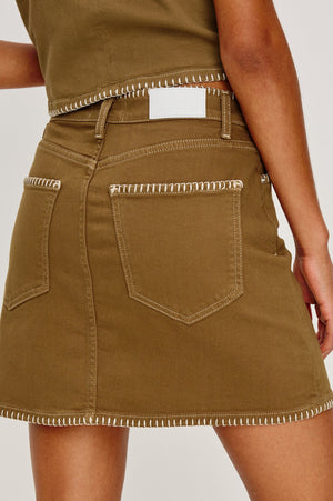 Inspired by 'It' girls of the 90s, the Laurel is a high-rise mini with a fitted waist, zipper fly, and A-line shape. Complete with a contrast white blanket stitch in a 100% cotton fabrication, this skirt is an instant classic.