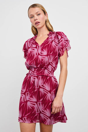 The Terrin throws it back to the 70s with a free-flowing silhouette and chiffon fabrication. It features ruffles at the yoke, a smocked waist and elasticated short sleeves, as well as a lined mini-length skirt.