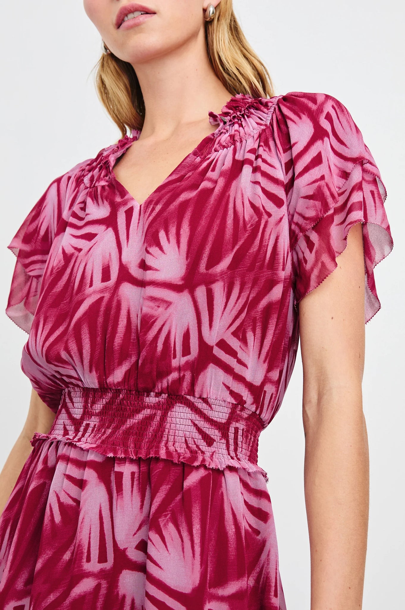 The Terrin throws it back to the 70s with a free-flowing silhouette and chiffon fabrication. It features ruffles at the yoke, a smocked waist and elasticated short sleeves, as well as a lined mini-length skirt.
