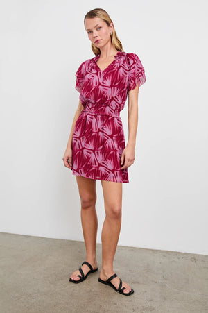 The Terrin throws it back to the 70s with a free-flowing silhouette and chiffon fabrication. It features ruffles at the yoke, a smocked waist and elasticated short sleeves, as well as a lined mini-length skirt.