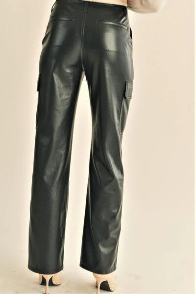 Upgrade your wardrobe with Reset by Jane's Carrie faux leather pants. With a straight loose silhouette, these pants provide both comfort and style. Featuring button and zipper closures, belt hoops, and pockets on mid-thighs, these pants are functional and fashionable. Plus, with mock back pockets and a solid color, you'll be turning heads wherever you go. Make a statement with these unique pants!