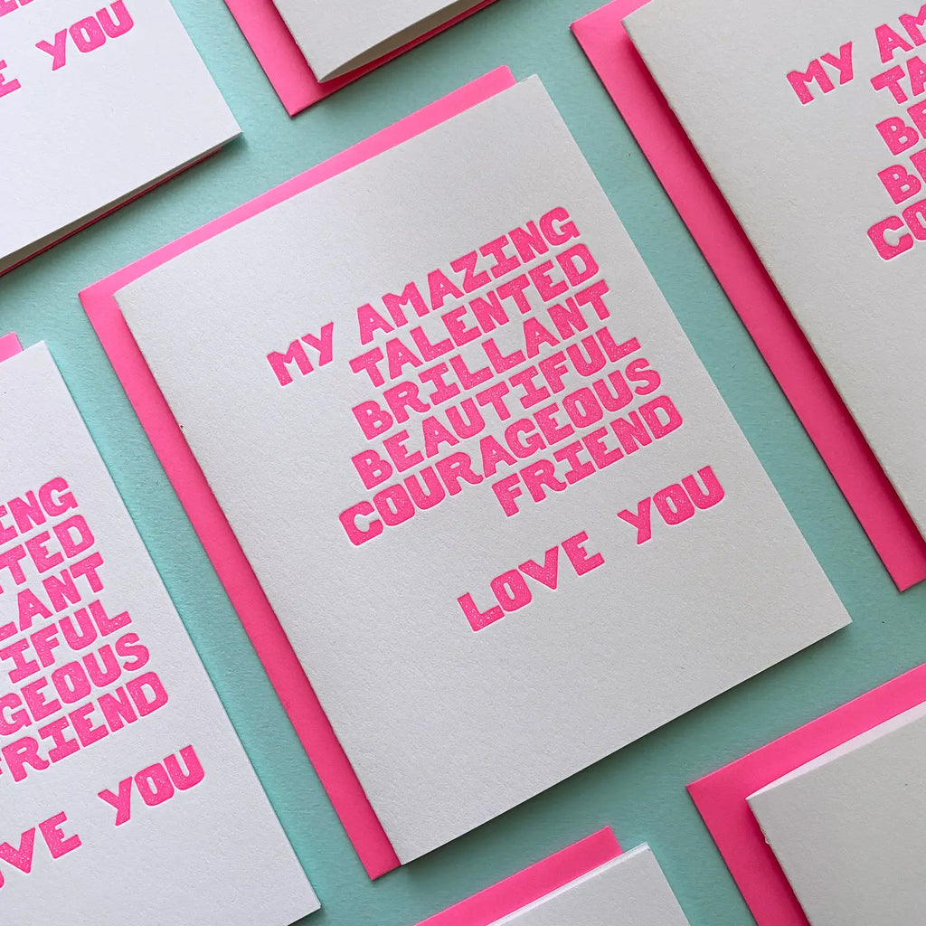 Card with pink text on a teal background