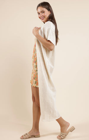 Spice up your outfit with the Sadie & Sage Cheese Board kimono! This short sleeve long kimono is the perfect statement piece for any look. So go ahead, add some extra flavor to your wardrobe.