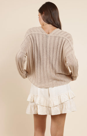 Cozy up in the Sadie & Sage Devon sweater, featuring a charming wide rib knit that adds texture and warmth. Perfect for layering or wearing solo, this playful piece brings a fun twist to your casual wardrobe while keeping you snug all day long.