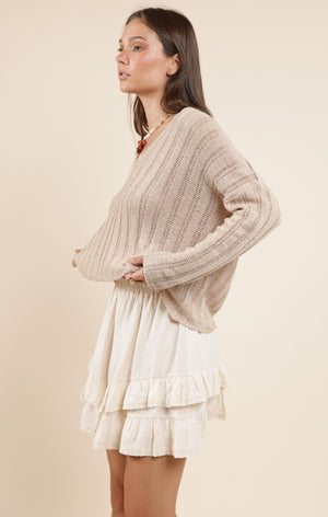 Cozy up in the Sadie & Sage Devon sweater, featuring a charming wide rib knit that adds texture and warmth. Perfect for layering or wearing solo, this playful piece brings a fun twist to your casual wardrobe while keeping you snug all day long.