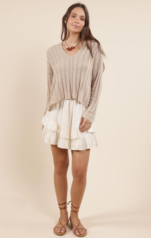 Cozy up in the Sadie & Sage Devon sweater, featuring a charming wide rib knit that adds texture and warmth. Perfect for layering or wearing solo, this playful piece brings a fun twist to your casual wardrobe while keeping you snug all day long.