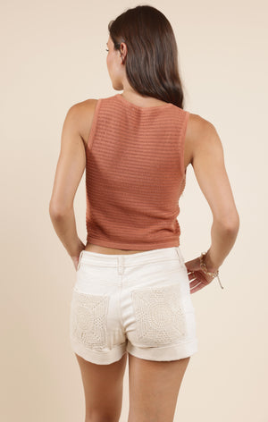 Stay cozy and stylish with the Sadie & Sage Meg sweater tank. This playful piece blends the comfort of a sweater with the ease of a tank, perfect for layering or wearing solo on warmer days. Its soft fabric and relaxed fit make it your new go-to for effortless cool vibes all season long.