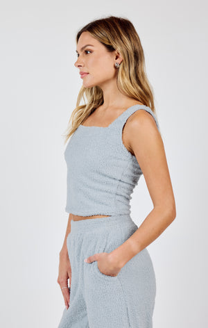 Add some edge to your wardrobe with Sadie & Sage's Mind You square neck cropped knit top. Keep it cool and cozy with this unique top that's perfect for any occasion.