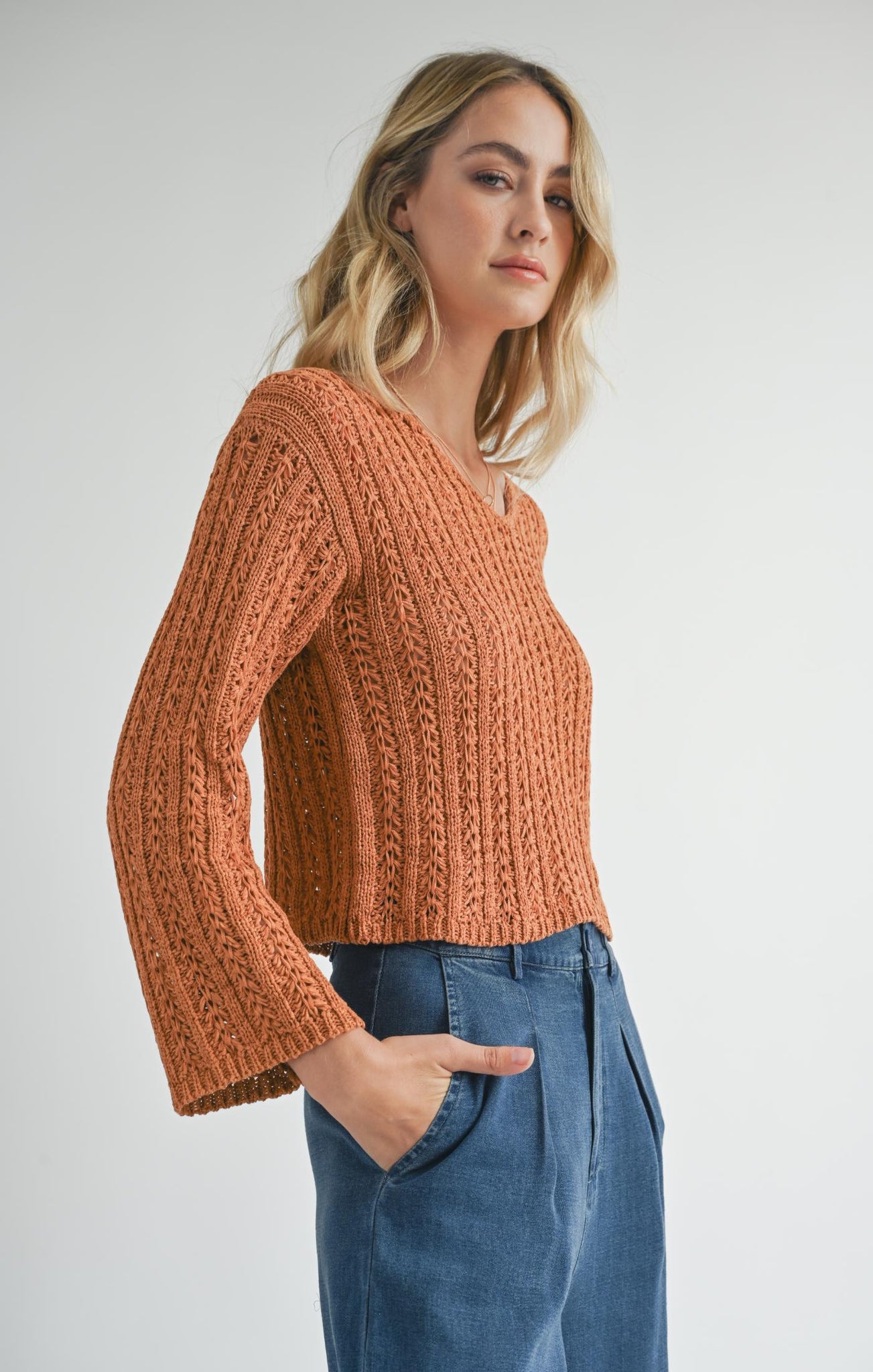 Stay in the flow with Sadie &amp; Sage's Perfect Flow pointelle knit sweater. This cozy knit adds texture to your wardrobe, while keeping you stylishly warm. Perfect for any season, it's the ideal choice for a laid back, yet chic look. Stay cozy, stay stylish.