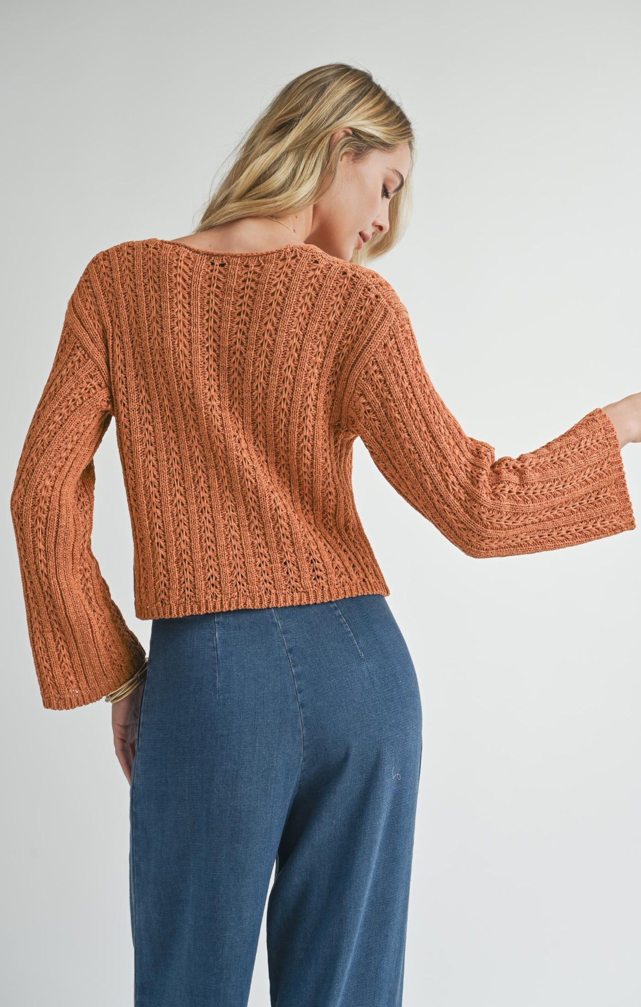 Stay in the flow with Sadie &amp; Sage's Perfect Flow pointelle knit sweater. This cozy knit adds texture to your wardrobe, while keeping you stylishly warm. Perfect for any season, it's the ideal choice for a laid back, yet chic look. Stay cozy, stay stylish.