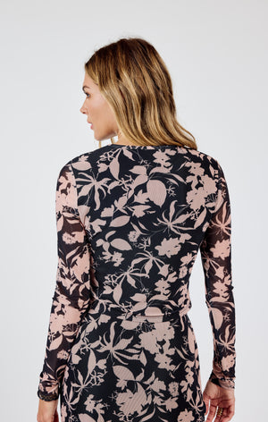 Revitalize your wardrobe with Sadie & Sage's Rejuvenate top. This floral mesh long sleeve offers a fresh take on everyday style, perfect for adding a touch of whimsy to any outfit. Embrace your playful side with this unique piece!