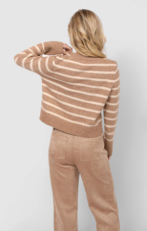 Person wearing a brown and beige striped sweater and matching pants against a white background