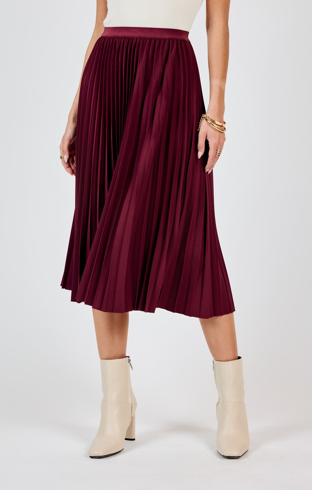 Get ready to make a statement in the Sadie & Sage Silent Streets pleated midi skirt! With its unique pleated design, this skirt adds a touch of playfulness and personality to any outfit. Perfect for standing out in a crowd and bringing a smile to everyone's face. (Warning: may cause excessive twirling and compliments!)