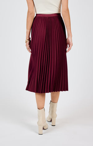 Get ready to make a statement in the Sadie & Sage Silent Streets pleated midi skirt! With its unique pleated design, this skirt adds a touch of playfulness and personality to any outfit. Perfect for standing out in a crowd and bringing a smile to everyone's face. (Warning: may cause excessive twirling and compliments!)