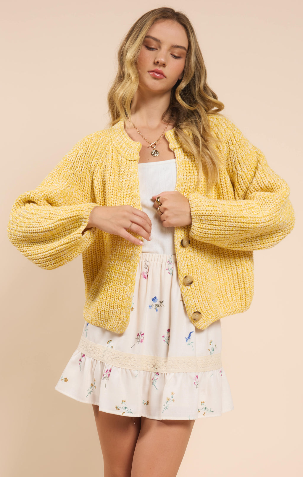 Stay chic and cozy with Sadie & Sage's Sunroof half button cardigan. Perfect for layering, this cardigan adds a touch of playfulness to any outfit. Keep the sun out and your style on point with Sunroof!