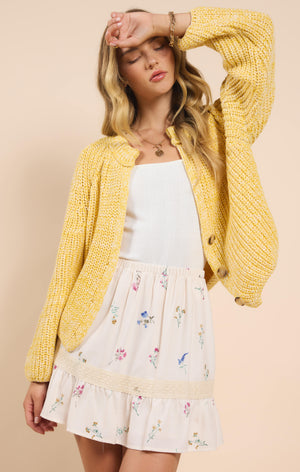 Stay chic and cozy with Sadie & Sage's Sunroof half button cardigan. Perfect for layering, this cardigan adds a touch of playfulness to any outfit. Keep the sun out and your style on point with Sunroof!