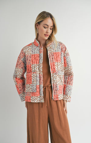 Upgrade your outerwear game with Sadie &amp; Sage's The Collector patchwork quilted jacket. This unique and playful piece boasts a quilted design with a mix of fabrics, perfect for making a statement on any adventure. Keep warm and stylish in this must-have jacket.