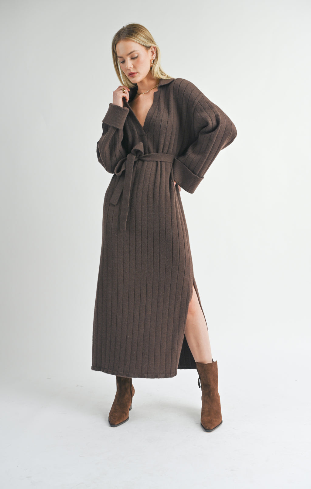 Introducing Amber from Sage the Label. Keep it cozy and stylish with this unique piece that beautifully combines a sweater and midi dress. With a waist tie for a flattering fit, you'll stay warm and chic all day long!