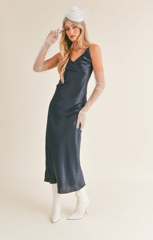 Be the star of any occasion in this Sage The Label maxi dress! Featuring a back strap detail, you'll be turning heads with your show stopping look. Get ready to dance the night away in style and confidence!