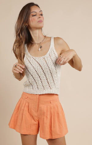 Sip your morning brew in style with Sage the Label's Coffee to Go sweater tank. This quirky and playful top combines the comfort of a sweater with the breeziness of a tank. Perfect for staying cozy on the go!