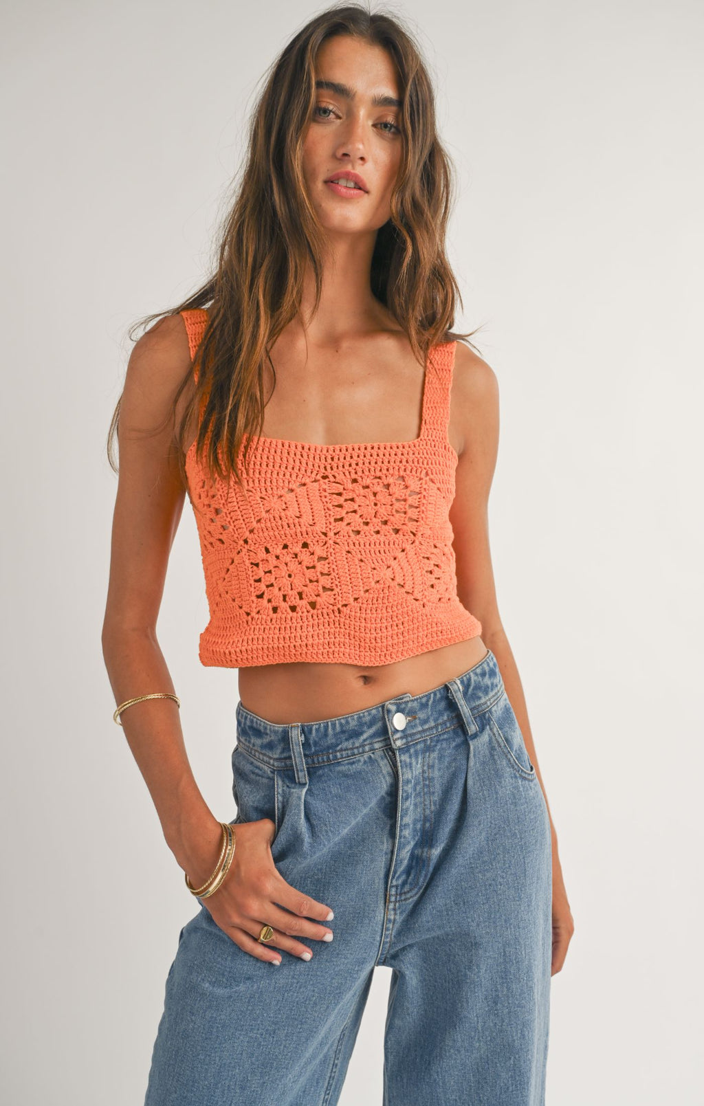 Get ready to make a statement with Sage the Label's Quinn crochet crop top. This unique top combines the beauty of crochet with the trendiness of a crop top. Perfect for summer days or nights, this top will have you looking and feeling stylish and confident.