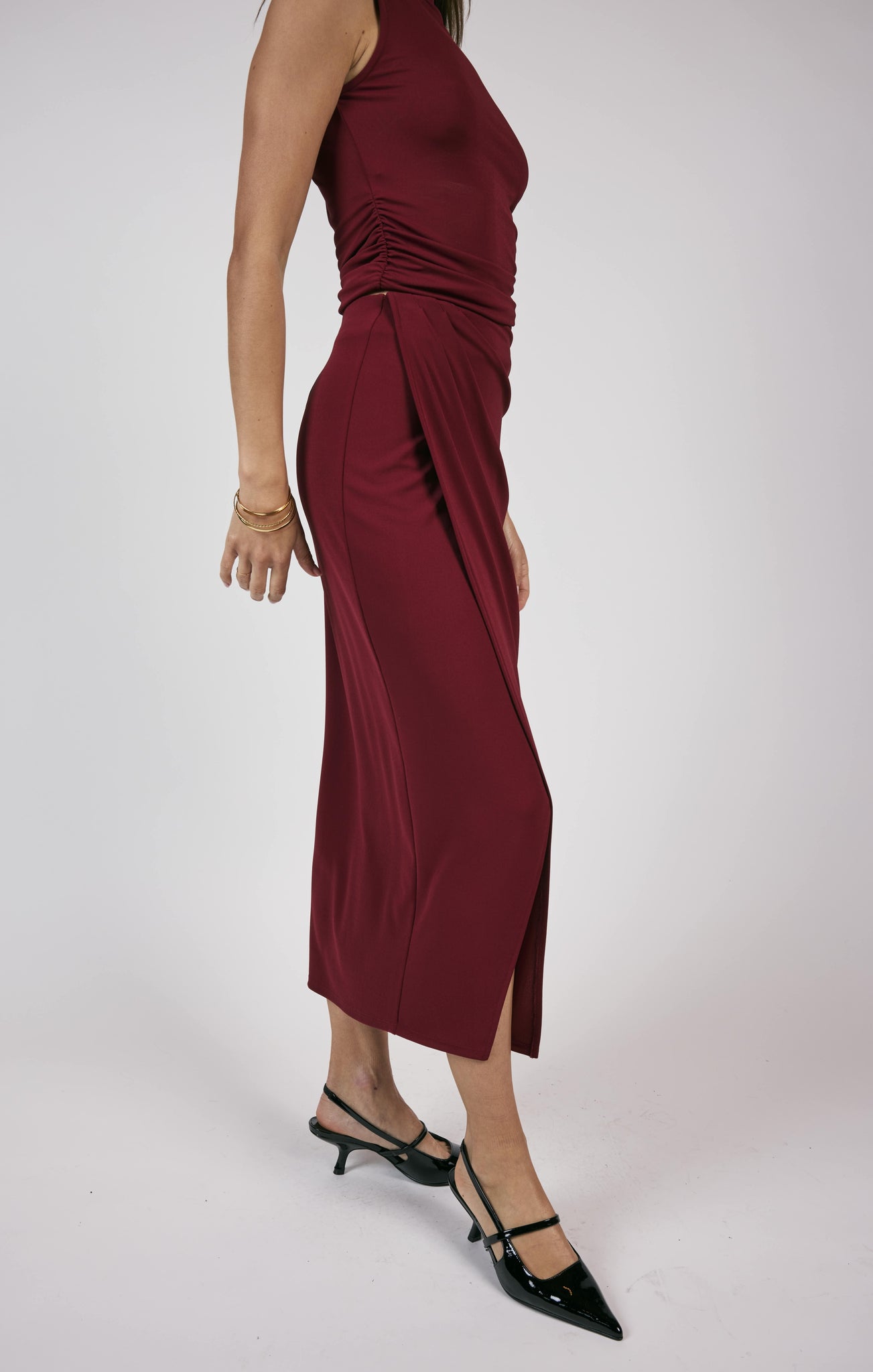 Unleash your fiery spirit with Sage the Label's Pleated Overlap Knit Midi Skirt. This playful skirt features unique pleats and a midi length for an effortlessly stylish look. Perfect for adding a touch of quirkiness to your wardrobe.