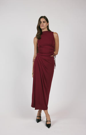 Unleash your fiery spirit with Sage the Label's Pleated Overlap Knit Midi Skirt. This playful skirt features unique pleats and a midi length for an effortlessly stylish look. Perfect for adding a touch of quirkiness to your wardrobe.