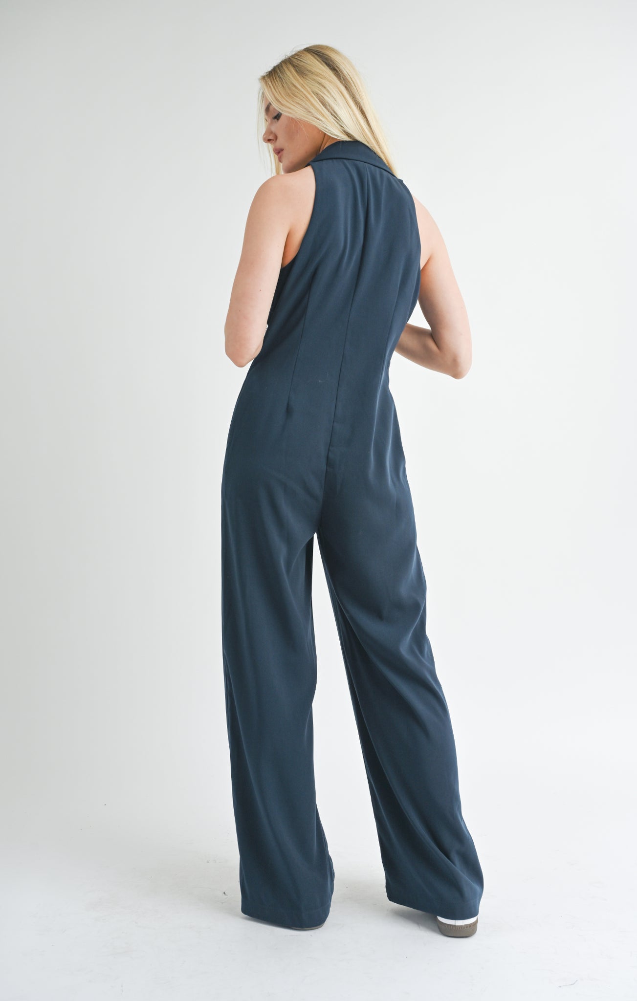 Elevate your style game with the Finest Touch halter jumpsuit from Sage the Label. This trendy one-piece features a flattering halter neckline and is perfect for any occasion. Make a statement with ease and show off your playful side in this unique piece.