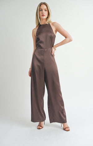 Introducing the Sage the Label Flawless jumpsuit. This halter jumpsuit is a game-changer for your wardrobe. Say goodbye to boring outfits and hello to effortless style. Perfect for any occasion, this jumpsuit will make you look and feel flawless. Get ready to turn heads!