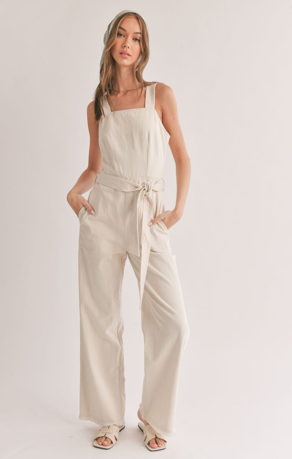 Step effortlessly into style with Sage the Label's "Gia" belted denim overall. No matter what you pair with it, this quirky and playful overall will elevate your look with its double meanings and word play. Dress it up or down, this overall is sure to make a statement!