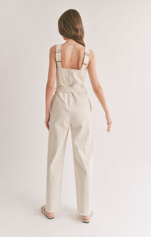 Step effortlessly into style with Sage the Label's "Gia" belted denim overall. No matter what you pair with it, this quirky and playful overall will elevate your look with its double meanings and word play. Dress it up or down, this overall is sure to make a statement!