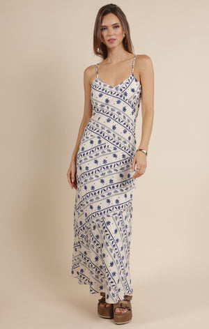 Step into effortless charm with the Sage the Label Great Springs printed maxi slip dress. Its flowing silhouette and delicate print make it perfect for sunny days and breezy evenings. Slip it on for a playful, carefree look that moves with you, whether you're strolling the beach or dancing under the stars.