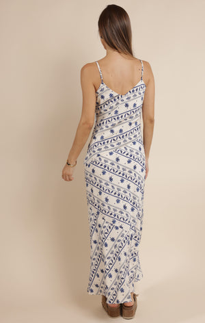 Step into effortless charm with the Sage the Label Great Springs printed maxi slip dress. Its flowing silhouette and delicate print make it perfect for sunny days and breezy evenings. Slip it on for a playful, carefree look that moves with you, whether you're strolling the beach or dancing under the stars.