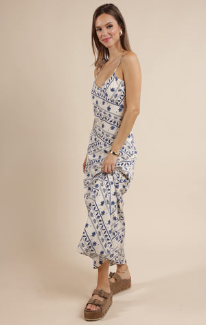 Step into effortless charm with the Sage the Label Great Springs printed maxi slip dress. Its flowing silhouette and delicate print make it perfect for sunny days and breezy evenings. Slip it on for a playful, carefree look that moves with you, whether you're strolling the beach or dancing under the stars.