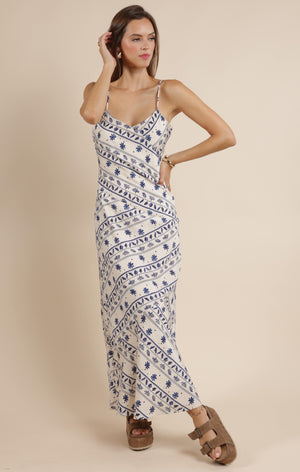 Step into effortless charm with the Sage the Label Great Springs printed maxi slip dress. Its flowing silhouette and delicate print make it perfect for sunny days and breezy evenings. Slip it on for a playful, carefree look that moves with you, whether you're strolling the beach or dancing under the stars.