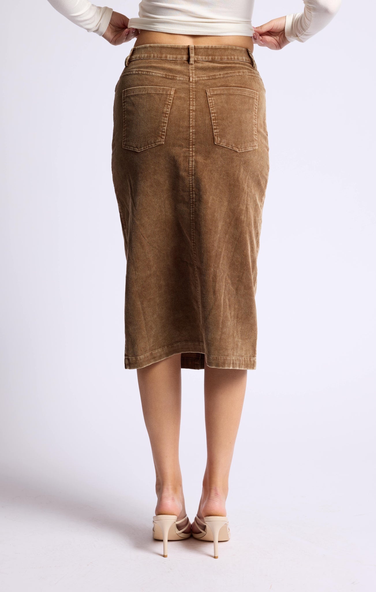 "Grab a 'washed cord' of this playful midi skirt and make a statement with Sage the Label's Kahlo. The unique texture adds a touch of quirk to any outfit, making it perfect for any occasion. Embrace the playful side of fashion with this versatile piece.