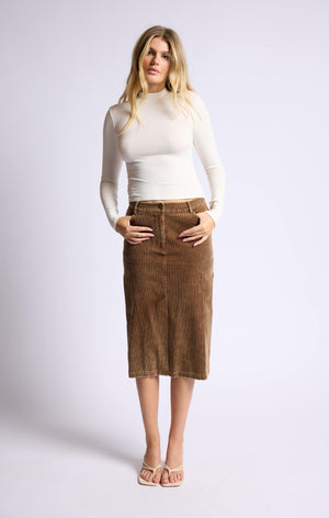 "Grab a 'washed cord' of this playful midi skirt and make a statement with Sage the Label's Kahlo. The unique texture adds a touch of quirk to any outfit, making it perfect for any occasion. Embrace the playful side of fashion with this versatile piece.