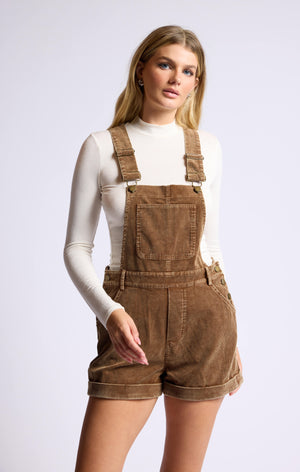 Rock the ultimate cool girl look with Sage the Label's Kahlo Overall! Made from washed cord, these short overalls add a playful and casual touch to any outfit. Perfect for effortless style and comfort, these overalls are a must-have in your wardrobe. (Overalls and chic? Cord-ially invited to try them!)