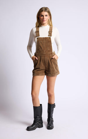 Rock the ultimate cool girl look with Sage the Label's Kahlo Overall! Made from washed cord, these short overalls add a playful and casual touch to any outfit. Perfect for effortless style and comfort, these overalls are a must-have in your wardrobe. (Overalls and chic? Cord-ially invited to try them!)