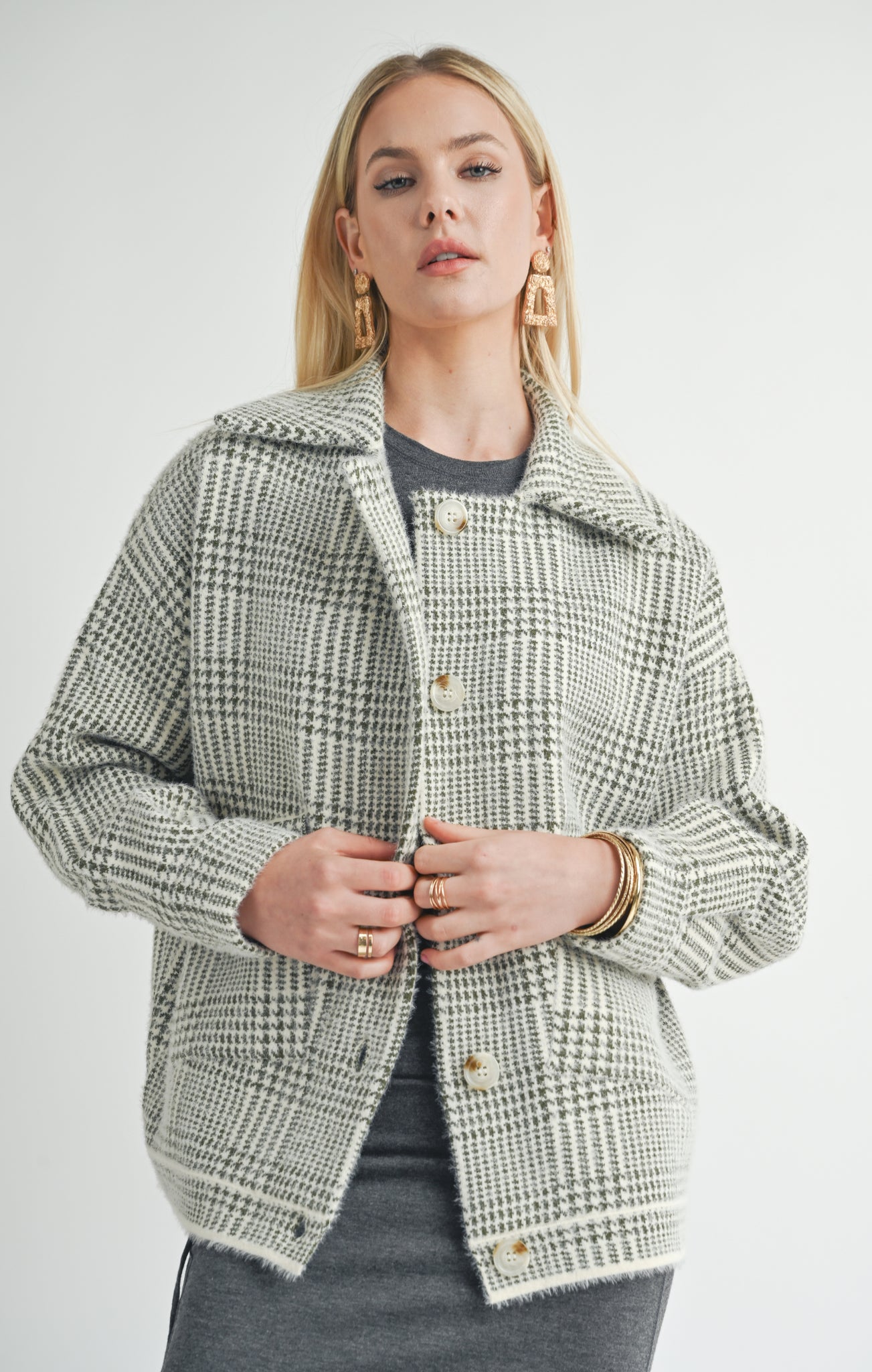 Stay stylish and cozy with Sage the Label's trendy Lola plaid sweater jacket. This playful jacket will add character to any outfit, while keeping you warm and comfortable. Don't sacrifice style for warmth - get the best of both worlds with Lola!