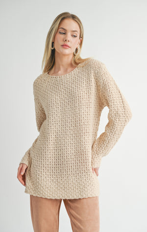 Stay cozy in the Sage the Label Maude sweater. Perfect for chilly days, this sweater will keep you warm and stylish. Made with high-quality fabric, it's comfortable and durable. A must-have for any wardrobe. (Sweater weather, anyone?)